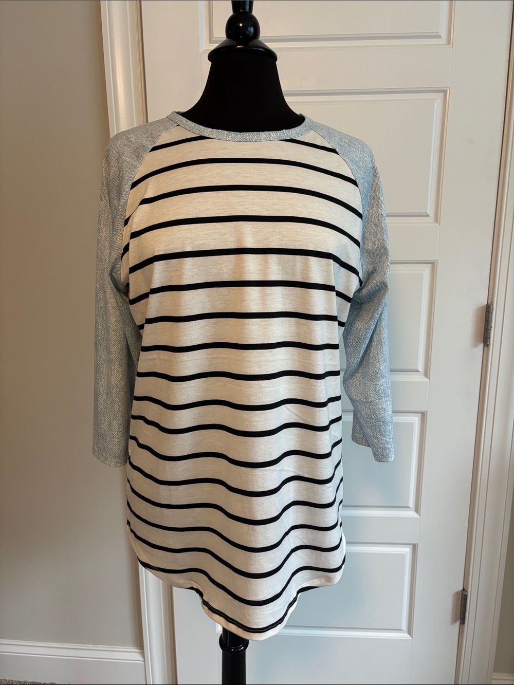 LuLaRoe Cream and Black Striped Raglan Top with Light Blue Sleeves